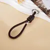 Pingente de Bolsa Simples Estilo Novo com Contas Prateadas, Corrente de Chaveiro Versátil de Corda de Couro Tecida à Mão com Nó Romano