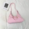 Bolsa feminina de alta qualidade 2026 primavera nova bolsa de ombro para o dia a dia, design de nicho simples e moderno bolsa de mão de ombro