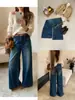Otoño TOP estilo europeo Guangzhou Trece Líneas jeans vintage de pierna recta lavados a la piedra pesada con bolsillos dobles en V y cinturón 82610