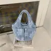 Bolsa de Tela Bordada Bolso de Mano para Mujer Gran Capacidad Múltiples Bolsillos Bolso Cubo para Viajes Diarios Bolso de Tela Simple Nuevo Estilo 2026 Bolso de Hombro