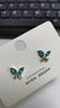 Nuevos pendientes de estilo chino S925 anti-plata para mujer, pendientes de mariposa de cristal de color, pendientes de hadas, elegantes pendientes de mariposa para mujer.