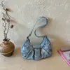 Nuevo estilo retro americano de viajero, bolsa de mano grande de pliegues para el verano 2026, bolso de hombro simple para mujer