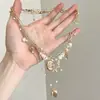 Colar Camadas Estilo Férias Doce e Fresco com Concha Dourada, Estrela-do-Mar, Pérola e Franja para Mulheres Design Étnico Litoral Corrente de Clavícula