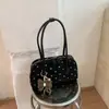 Bolso de hombro de moda estilo coreano con lunares Shuai Mijia 2026 otoño nuevo de gran capacidad para el trabajo bolso Boston exquisito