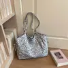 Bolso tote de estilo coreano de nicho con estampado de leopardo para mujer, nuevo bolso de hombro de moda 2026, gran capacidad, versátil y adecuado para el trabajo, hecho de lona