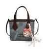 Bolsos Pequeños Populares de Este Año para Mujer Verano 2025 Nuevo Bolso de Hombro Cruzado Bolso de Mensajero Retro de Gama Alta Bolso Cubo