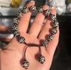 Venta al por mayor de fábrica Pulsera de joyería Xizang Tianzhu con cuentas redondas negras y blancas, patrón de herradura, pulpa envuelta, patrón desgastado, cuerda trenzada A