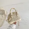Bolsa de Mão Nova Moda Primavera 2026 Estilo Étnico Bolsa de Concha Elegante Bolsa de Ombro Casual Simples Bolsa Transversal
