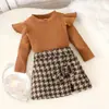 Comercio exterior Ropa infantil europea y americana Otoño e invierno Nuevo Camiseta de manga larga multicolor Camisa base de manga abullonada Traje de falda a cuadros con lazo