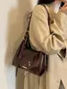 Bolso de mano para mujer 2026 nuevo simple color liso nicho retro versátil diario para ir al trabajo tote bandolera