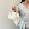 Bolso de Mano con Forma de Concha Retro Simple Elegante para Madre e Hijo Bolso Cruzado de Hombro Único Nuevo Primavera 2026 Bolso Casual de Moda para Mujer