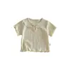 [No hay devoluciones ni cambios] Camiseta Fina Lisa de Color para Niñas 2026 Nuevo Verano Elegante Top de Manga Corta con Cuello de Muñeca para Bebés