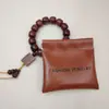Bolsa elástica de PU personalizada para joyería, bolsa de regalo para empaquetar joyería, bolsa de almacenamiento para anillos, pendientes, collares