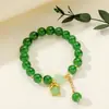 [Venta al por mayor directa de fábrica] Nuevo estilo chino Imitación Jade Dongling Puesto de Exhibición de Feria de Templo del Mercado Nocturno Pulsera de Vidrio Joyería Más Vendido