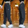 Pantalones Casuales de Sarga para Hombres y Mujeres Primavera y Otoño Pantalones Deportivos Sueltos Versátiles de Moda Tendencia Pantalones de Chándal Pernera Ajustada Hacia Abajo Dobladillo Harem