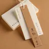 Etiqueta colgante para ropa Tarjeta de certificado personalizada Tarjeta colgante Logotipo de marca Etiqueta de ropa personalizada Ropa de mujer Sentido de alta gama