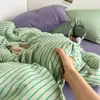 Juego de cuatro piezas de algodón lavado estilo minimalista coreano de alta calidad, juego de tres piezas con bloques de color para dormitorios de estudiantes, estilos de sábana plana y sábana ajustable, venta al por mayor