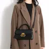 As bolsas novas populares deste ano, sensação de alta qualidade, bolsas quadradas pequenas retrô requintadas, bolsas femininas de nicho