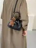 Bolso tipo cubo de alta gama para mujer 2026 nuevo estilo ins nicho bandolera bolso de mano de lujo ligero para el día a día colgante lindo
