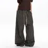 Pantalones casuales rectos de retazos a rayas estilo retro americano de otoño para hombres y mujeres, pantalones largos versátiles holgados de pierna ancha