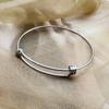 Nueva pulsera de actividad de acero inoxidable Amazon Hot Push-pull anillo de mano de acero de titanio fabricantes de accesorios simples europeos y americanos cabello lacio