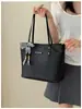 Bolso tote tejido vintage para mujer, modelo nuevo 2026, bolso de mano de gran capacidad para el trabajo con textura de piel sintética, bolso de moda para mujer al por mayor
