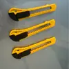 Cuchillo de utilidad al por mayor del fabricante Comercio exterior Cúter de oficina Cúter de papel Cúter de pared Cúter de caja Hoja de utilidad portátil