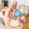Mini Cabeza de Perro de Acrílico Lilith Llavero de Arena Líquida Muñeca Linda Colgante Destellante Llavero de Regalo