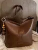 El nuevo bolso cubo de Shuai Mi es un bolso de mujer de gran capacidad, sencillo y casual para ir al trabajo, con un estilo coreano de lujo ligero y un diseño inspirado en Instagram, adecuado para llevar al hombro o cruzado.