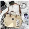 Bolsa tote de lona minimalista versátil estilo japonês para o dia a dia, bolsa de mão para estudante universitário, bolsa de ombro, bolsa transversal unissex
