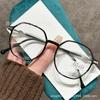 Gafas de lectura europeas y americanas transfronterizas nuevas moda femenina gafas de lectura anti-luz azul montura redonda retro color transparente gafas al por mayor
