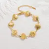 Joyería de Acero de Titanio Dongguan No se Desvanece Concha Hueca Vieiras Estilo Playa Océano Conjunto de Pulsera y Collar de Acero Inoxidable para Mujer