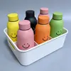 Novo copo de água com rosto sorridente, copo de vidro com concha plástica de dupla camada de alta estética, copo de presente para evento de celebração de loja promocional atacado
