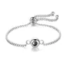 Pulsera de proyección con texto nanomicrotallado "Te amo" en 100 idiomas, estilo europeo y americano, con bocetos a color.