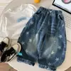 Pantalones vaqueros para niño Kino, ropa infantil de otoño, pantalones casuales versátiles, pantalones con estampado de estrellas estilo coreano, elegantes pantalones de pierna curva para bebés