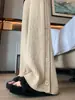 Nova coleção de outono e inverno estilo coreano: Calças pantalona de alta qualidade, com corte solto, macias e confortáveis para mulheres, apresentando um design relaxado e fluido com malha no comprimento do chão