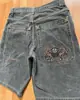 Pantalones cortos de mezclilla estampados de hip-hop europeos y americanos de fábrica directa transfronteriza para hombre, marca de moda americana, casual, pierna ancha