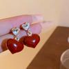 Aretes de botón de perla roja de Año Nuevo con aguja de plata chapada en oro real, aretes retro de nicho, aretes de personalidad de lujo ligero de alta gama para mujer