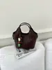 2026 Nuevo Bolso Cubo Tejido de Temperamento Sencillo Bolso de Mano Elegante Casual de Moda Bolso Cruzado Popular de Hombro Único