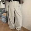 Pantalones de mujer de alta gama de moda de Dongdaemun, Corea, continúan el ambiente relajado con su diseño de corte curvo, nuevas llegadas de otoño, pantalones casuales increíblemente elegantes.