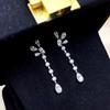 Cao Shi Fashion Pendientes de Botón Pequeños Frescos Elegantes de Flores Gotas de Agua Borla Imitación Pendientes Largos de Alta Gama Pendientes Adelgazantes para Mujer