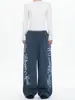 Calça de moletom da moda estilo americano, com estampa marmorizada, perna larga e cordão, para homens e mulheres, apresentando um design solto de perna reta, perfeita para outono e inverno