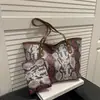 Moda de Verano 2026 Bolso Nuevo Elegante de un Solo Hombro Versión Coreana de Alto Valor Portátil Bolso Tote de Gran Capacidad para Mujeres