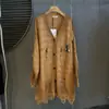 Nuevo Abrigo de Punto Holgado con Cuello en V de Longitud Media Estilo Wasteland Vintage Otoño 2026 con Dobladillo de Borlas