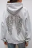 Conjunto de Moletom e Calça Casual Feminino Tendência Outono e Inverno Europeu e Americano com Asas de Lantejoula Moda Versátil Cor Sólida Conjunto de Duas Peças Venda por Atacado