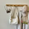 Bolsa de ombro e transversal versátil estilo coreano da moda, transfronteiriça, para mulheres, novo modelo 2026, design de nicho de alta estética