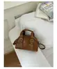 Bolso de mano de moda transfronterizo para mujer, bolso de hombro simple 2026, bolso tipo concha versátil y elegante para el día a día, bolso cruzado
