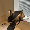 Bolsas Creativas de Retazos Primavera 2026 Bolso Tote de Gran Capacidad Diseño Elegante Bolso de Hombro Versátil Bolso de Mujer de Alta Gama