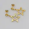 E62 Suministro del fabricante: Aretes grandes de estrella de cinco puntas color dorado de acero inoxidable, aretes redondos con acentos de diamantes blancos