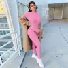 2026 Ropa de Mujer de Amazon de Venta Caliente Europea y Americana Cremallera Elástico Cuello Alto Bordado Ajustado Monos de Fitness Yoga